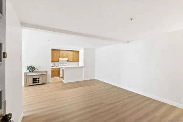 a view of a living room hardwood floor and a ceiling fan