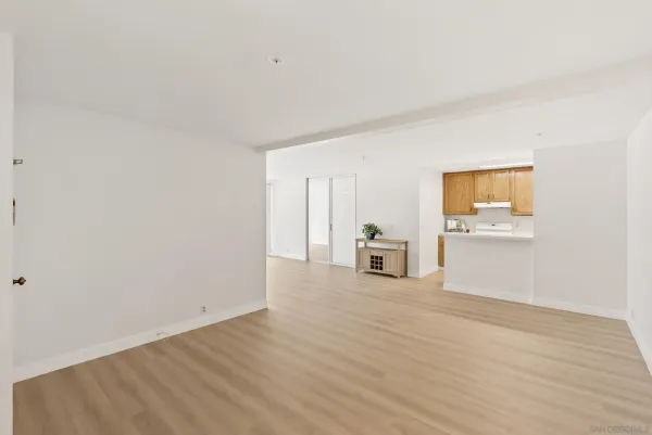a view of a kitchen with wooden floor