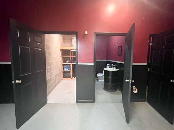 a kitchen with a refrigerator and a sink