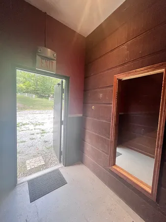 a view of room with window and door