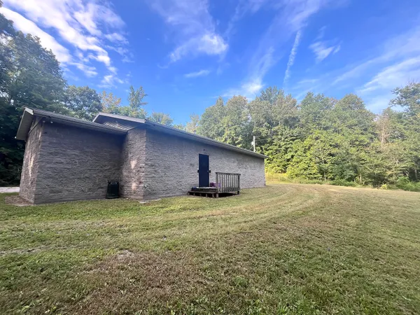 a view of a backyard of the house