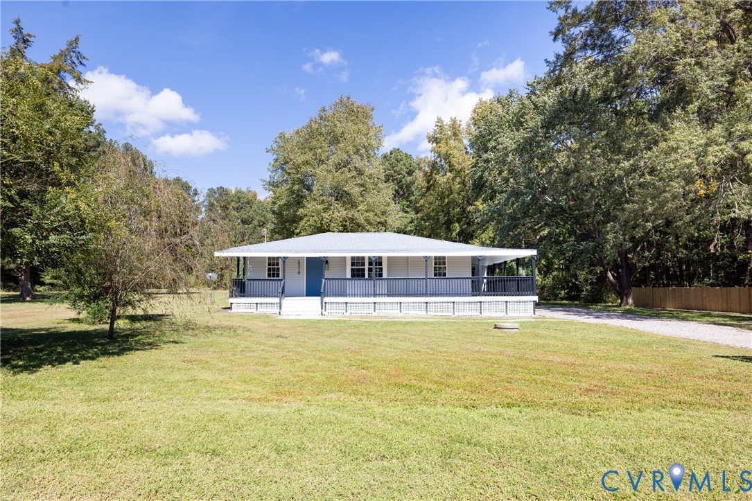 5318 Pine Hill Road Sutherland, VA 23885 - Photo 1 of 50 a large white house with a large pool