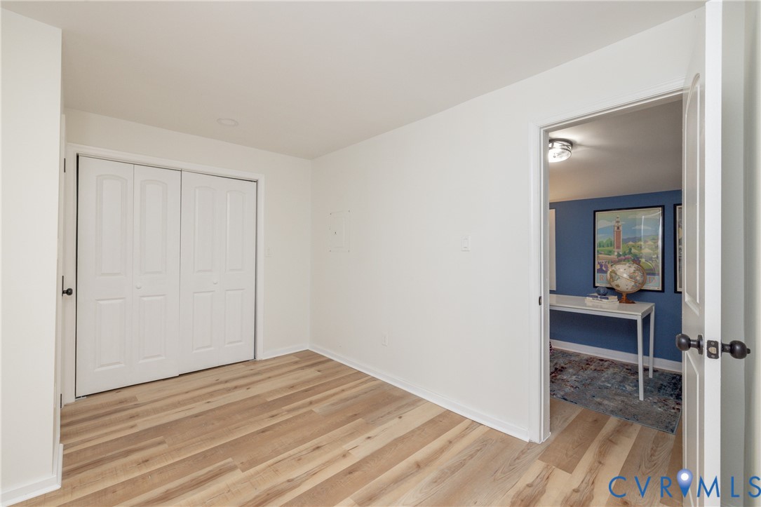 5318 Pine Hill Road Sutherland, VA 23885 - Photo 14 of 50 a view of a room with wooden floor closet and bedroom