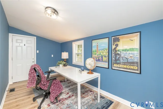 a view of a workspace with furniture