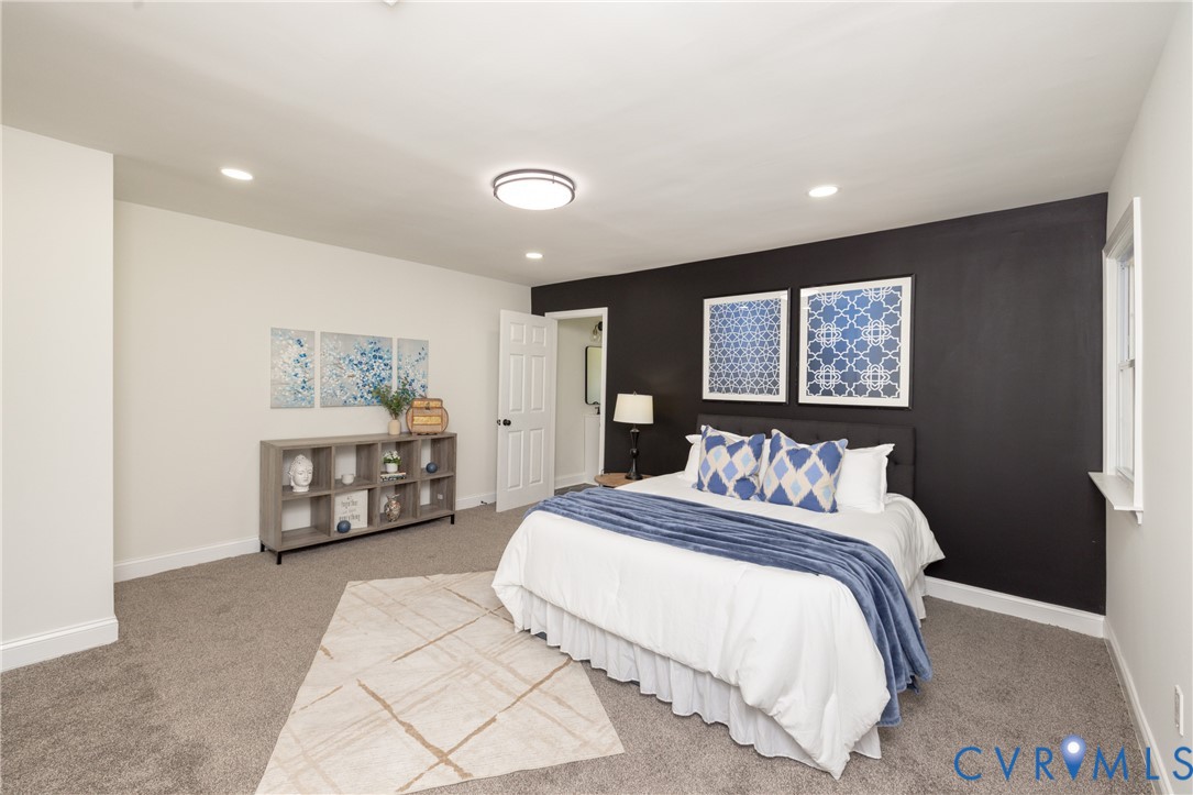 5318 Pine Hill Road Sutherland, VA 23885 - Photo 19 of 50 a bedroom with a bed mirror and window