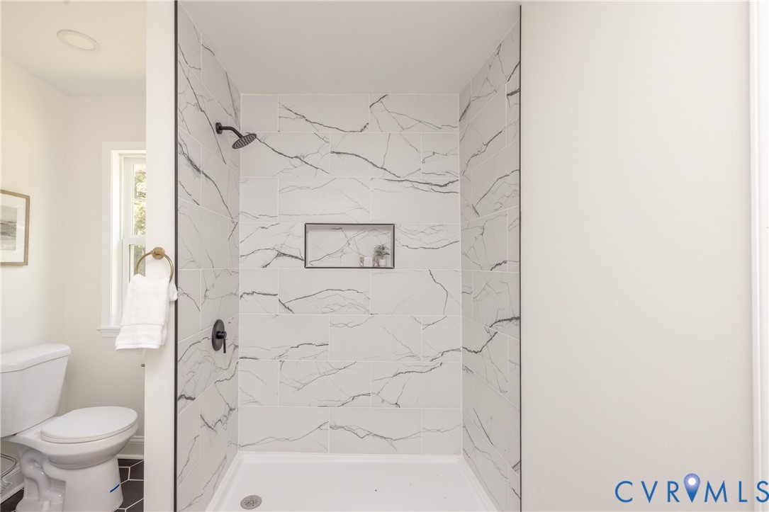 5318 Pine Hill Road Sutherland, VA 23885 - Photo 23 of 50 a bathroom with a toilet and shower