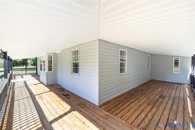 a view of a balcony with wooden floor