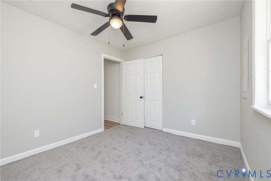 5318 Pine Hill Road Sutherland, VA 23885 - Photo 32 of 50 an empty room with a window and a fan