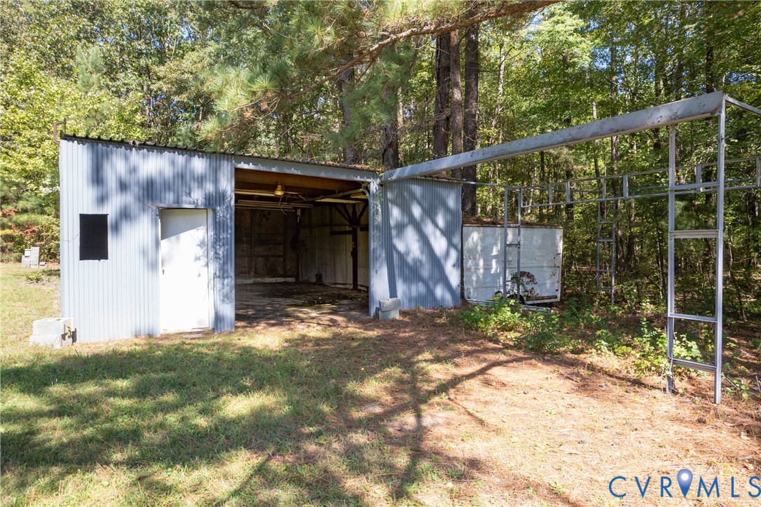 5318 Pine Hill Road Sutherland, VA 23885 - Photo 40 of 50 a backyard of a house with lots of green space