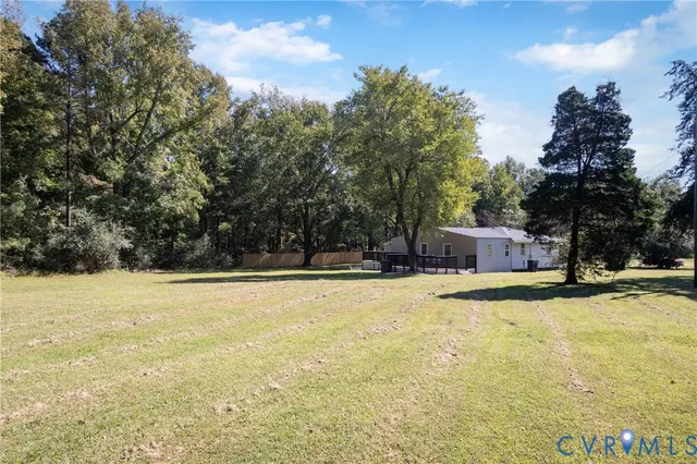 a view of a swimming pool with an outdoor space and seating area