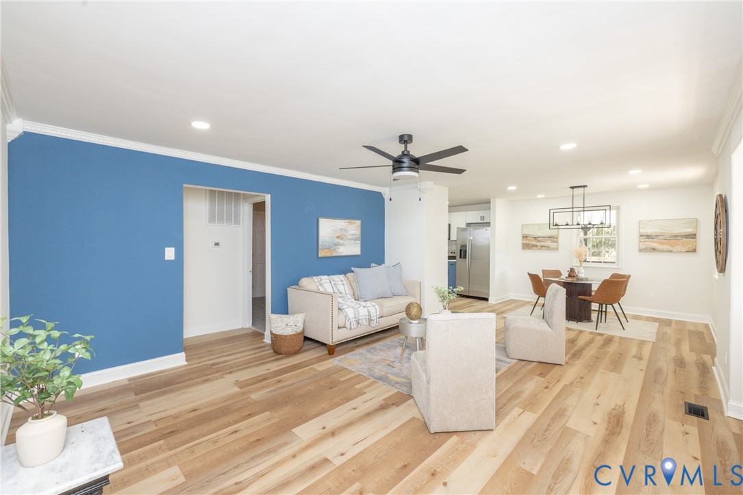 5318 Pine Hill Road Sutherland, VA 23885 - Photo 5 of 50 a living room with furniture and a chandelier