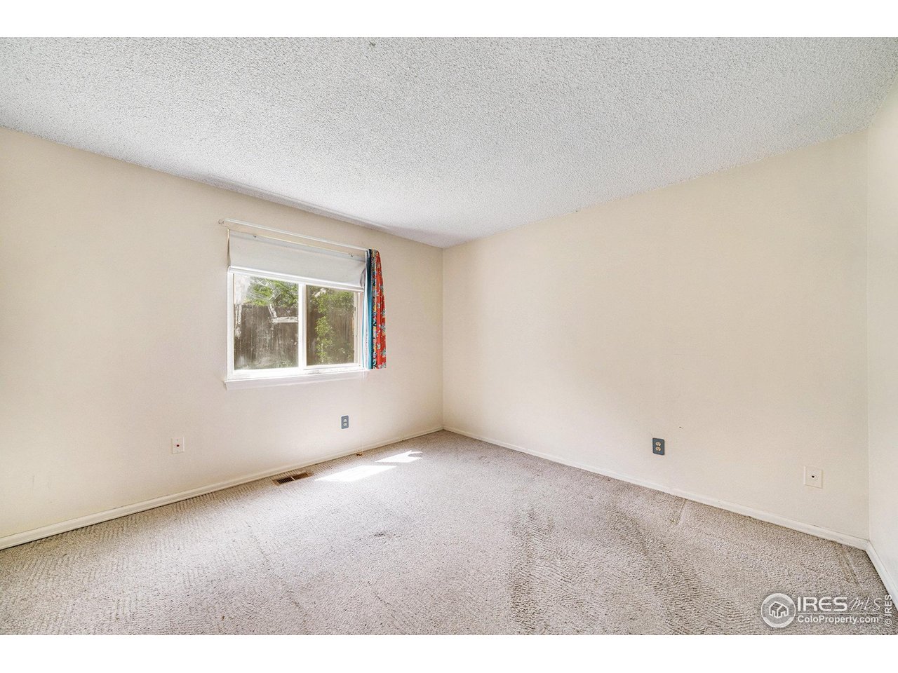 2167 Hackberry Circle Longmont, CO 80501 - Photo 12 of 23 an empty room with windows