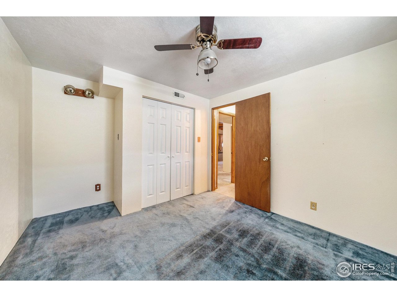 2167 Hackberry Circle Longmont, CO 80501 - Photo 15 of 23 a view of a room with a ceiling fan