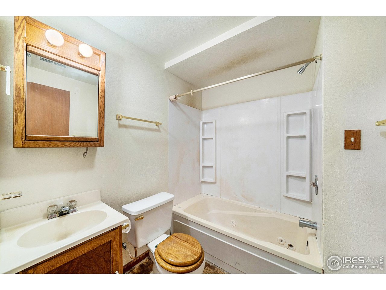 2167 Hackberry Circle Longmont, CO 80501 - Photo 16 of 23 a bathroom with a sink a toilet and a bathtub