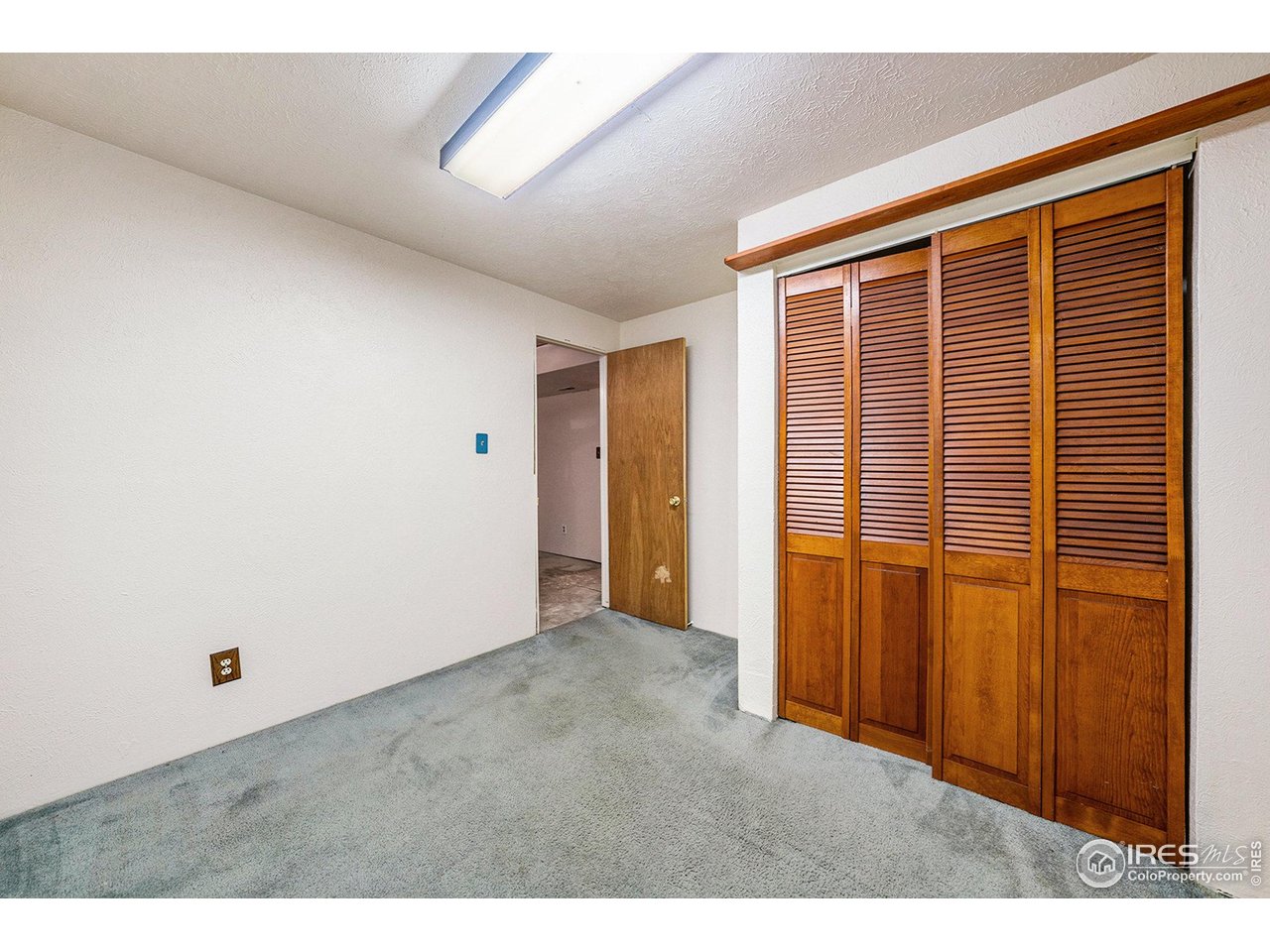 2167 Hackberry Circle Longmont, CO 80501 - Photo 17 of 23 a view of an empty room with closet