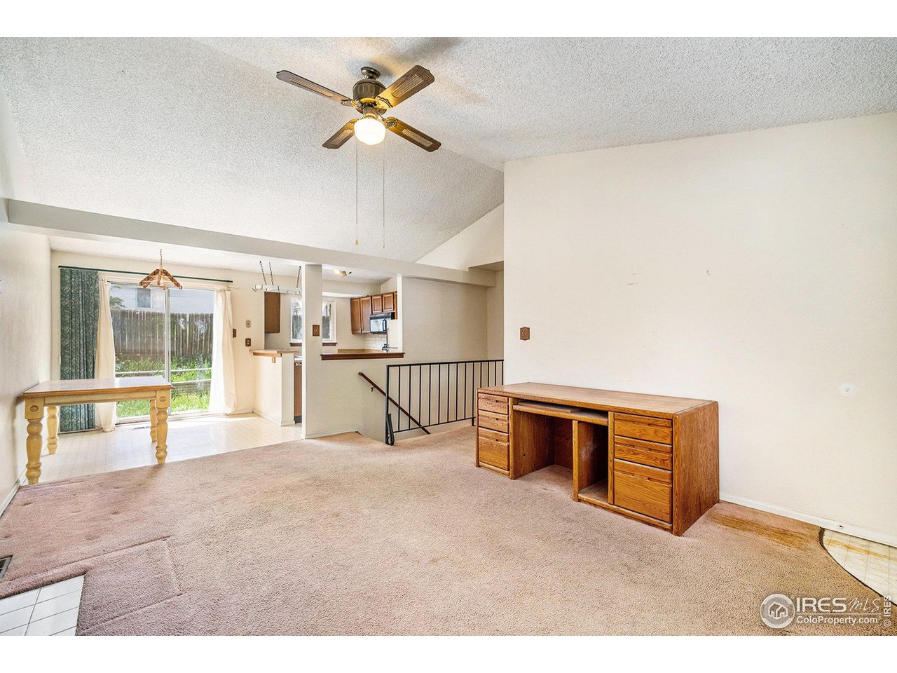 2167 Hackberry Circle Longmont, CO 80501 - Photo 3 of 23 a living room with stainless steel appliances kitchen island granite countertop furniture and a view of kitchen