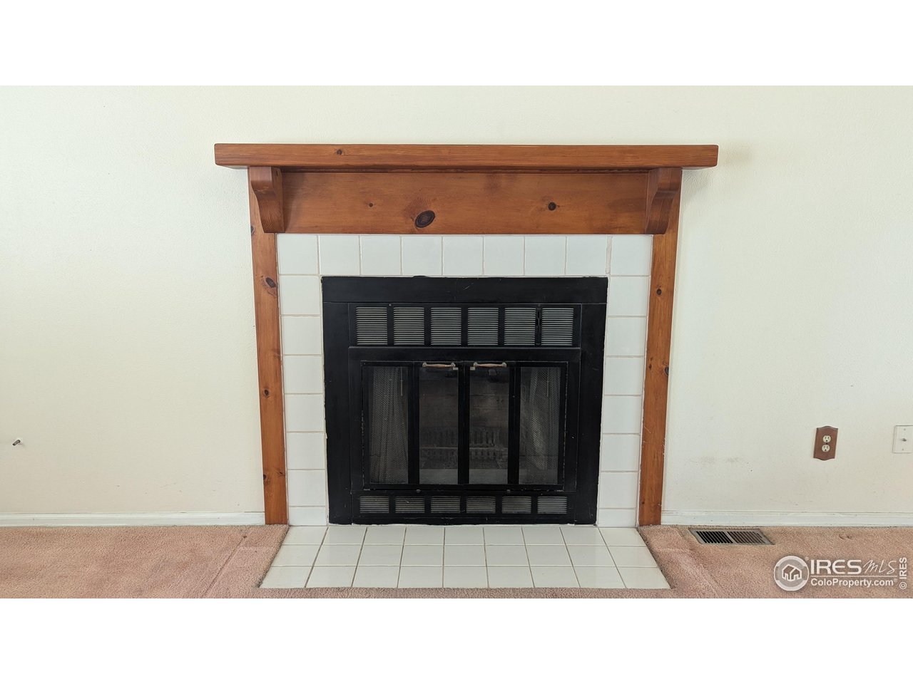 2167 Hackberry Circle Longmont, CO 80501 - Photo 5 of 23 a black and white photo of a fireplace