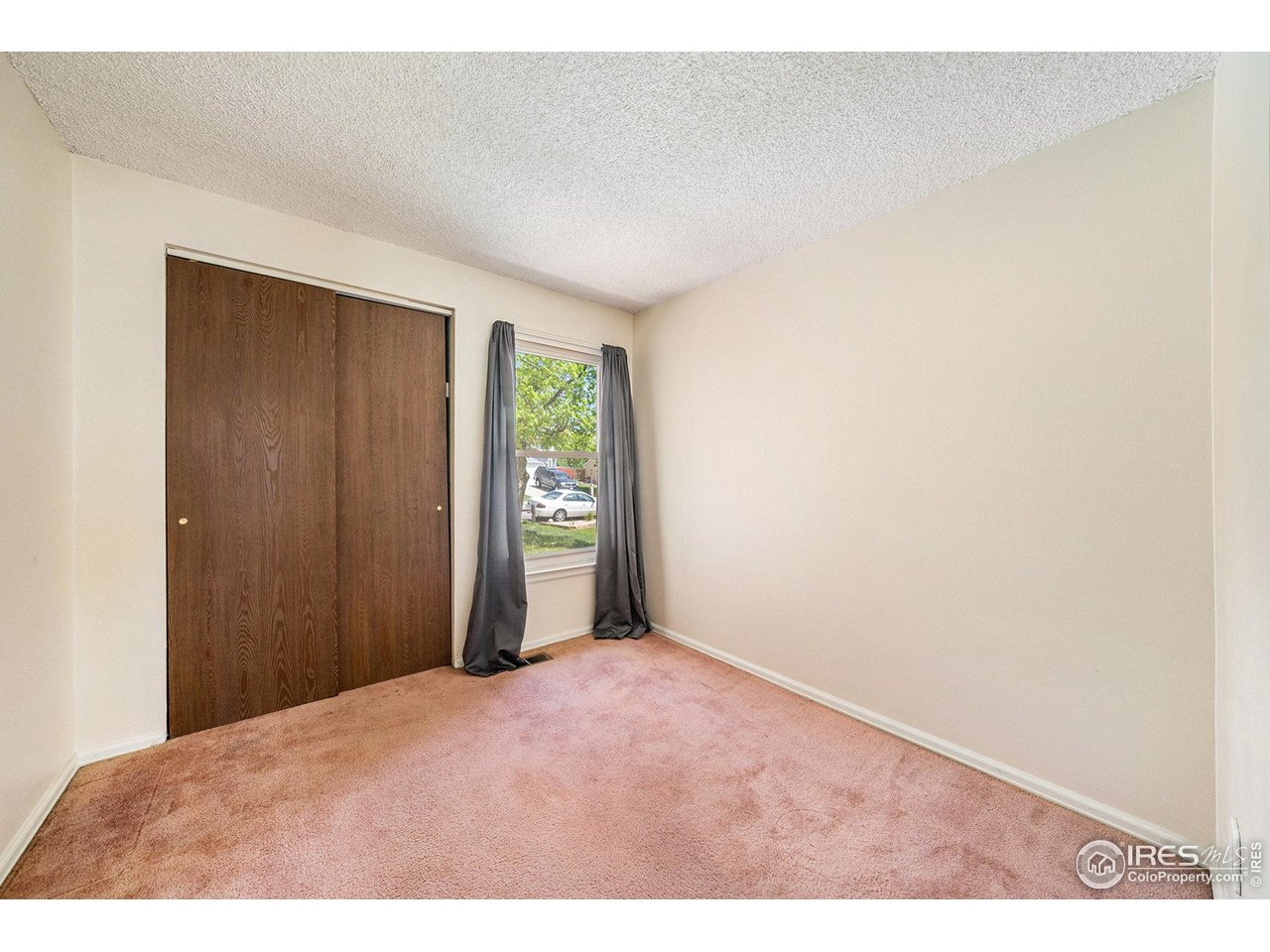 2167 Hackberry Circle Longmont, CO 80501 - Photo 8 of 23 a view of an empty room and window