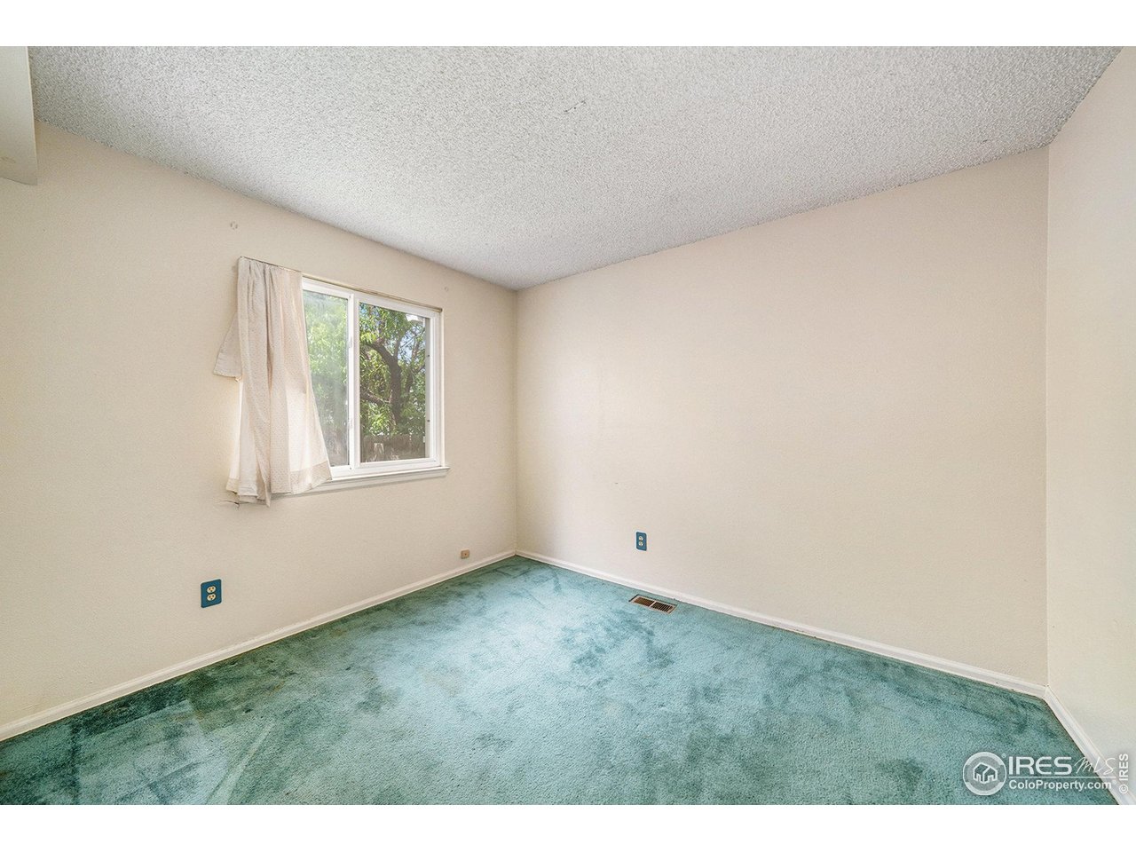 2167 Hackberry Circle Longmont, CO 80501 - Photo 10 of 23 a view of an empty room with a window
