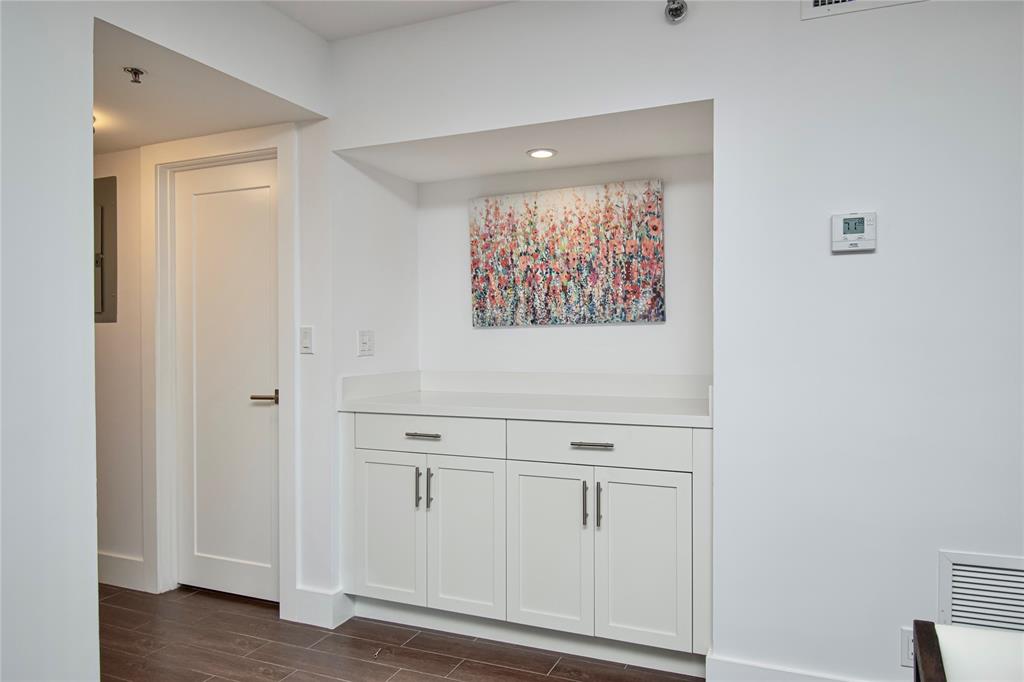 1612 Bridgewood Drive, Unit 1612 Boca Raton, FL 33434 - Photo 15 of 38 a view of a hallway with wooden floor