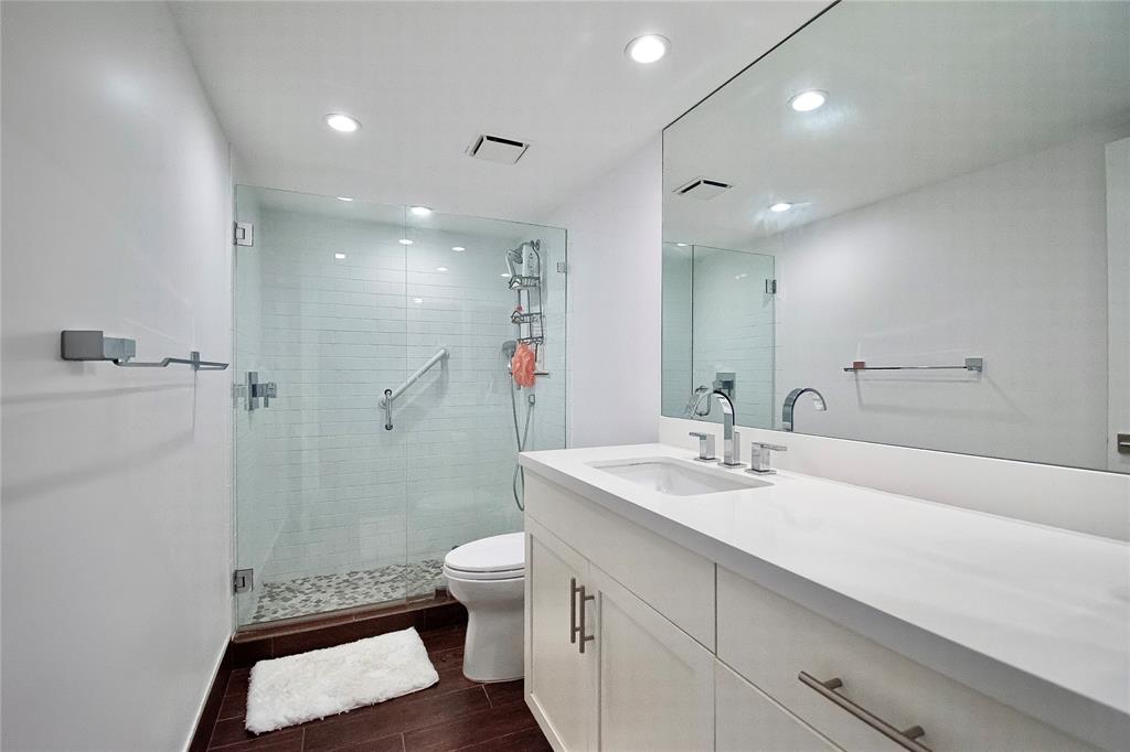 1612 Bridgewood Drive, Unit 1612 Boca Raton, FL 33434 - Photo 27 of 38 a bathroom with a sink a toilet and shower