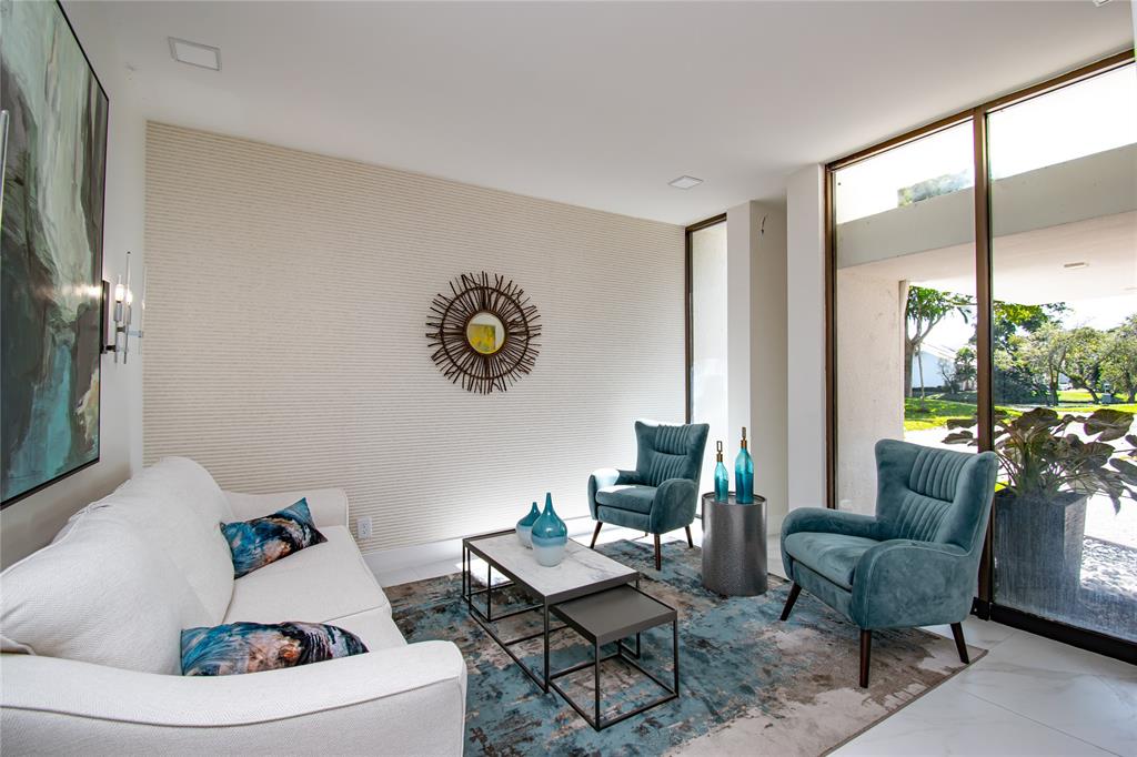 1612 Bridgewood Drive, Unit 1612 Boca Raton, FL 33434 - Photo 3 of 38 a living room with furniture and a large window