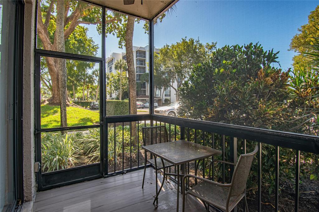 1612 Bridgewood Drive, Unit 1612 Boca Raton, FL 33434 - Photo 32 of 38 a view of a two chairs in the balcony
