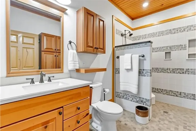 a bedroom with a bed and a large mirror