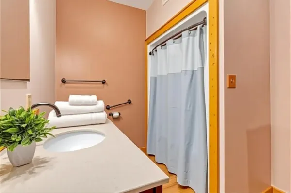 a bathroom with a sink and a mirror