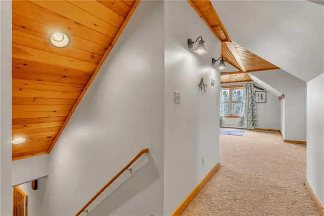 a view of a livingroom with wooden floor and a ceiling fan