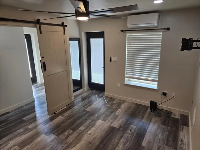 a view of a storage & utility room with closet window