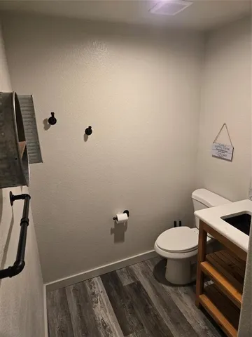 a bathroom with a toilet and a sink