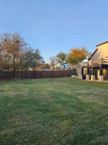 a view of outdoor space with deck and yard