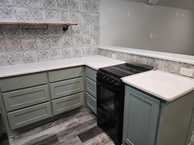 a utility room with cabinets