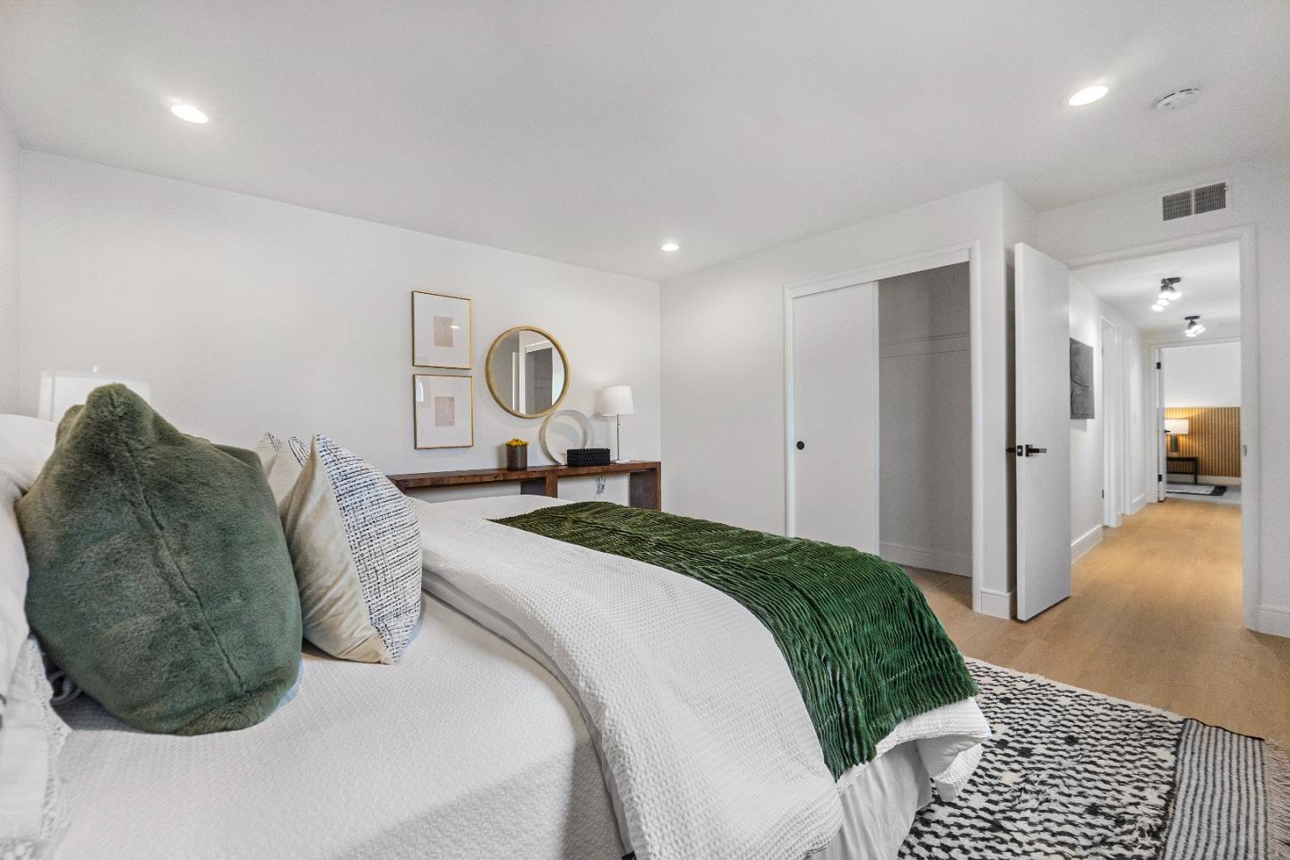 369 Ruth Avenue Mountain View, CA 94043 - Photo 12 of 33 a bedroom with a bed and a large mirror