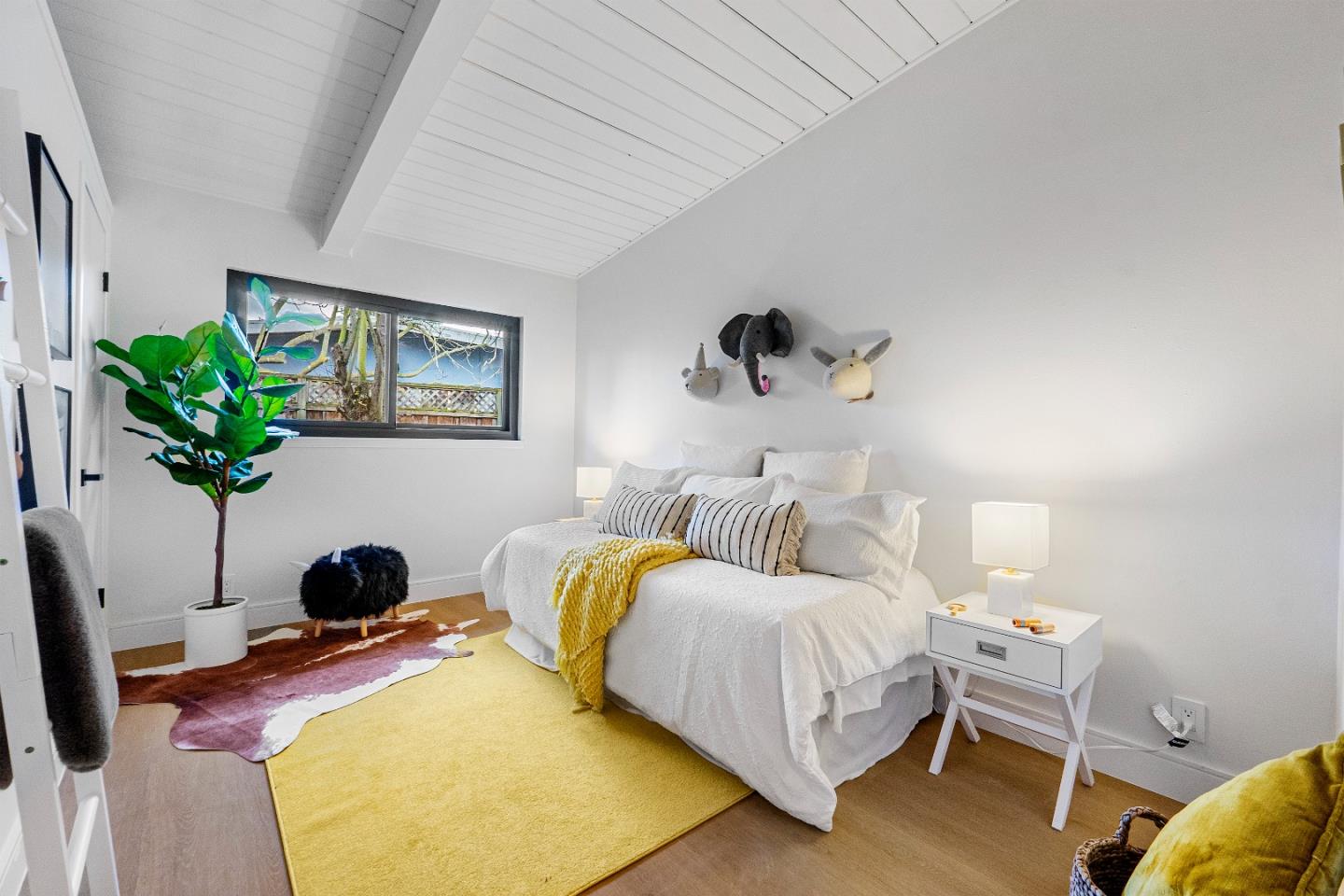 369 Ruth Avenue Mountain View, CA 94043 - Photo 13 of 33 a bedroom with bed and a potted plant