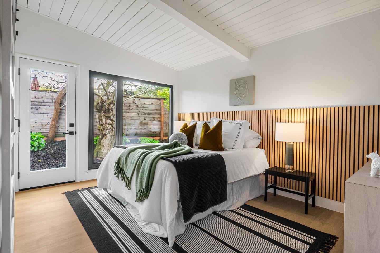 369 Ruth Avenue Mountain View, CA 94043 - Photo 18 of 33 a bedroom with a bed and wooden floor