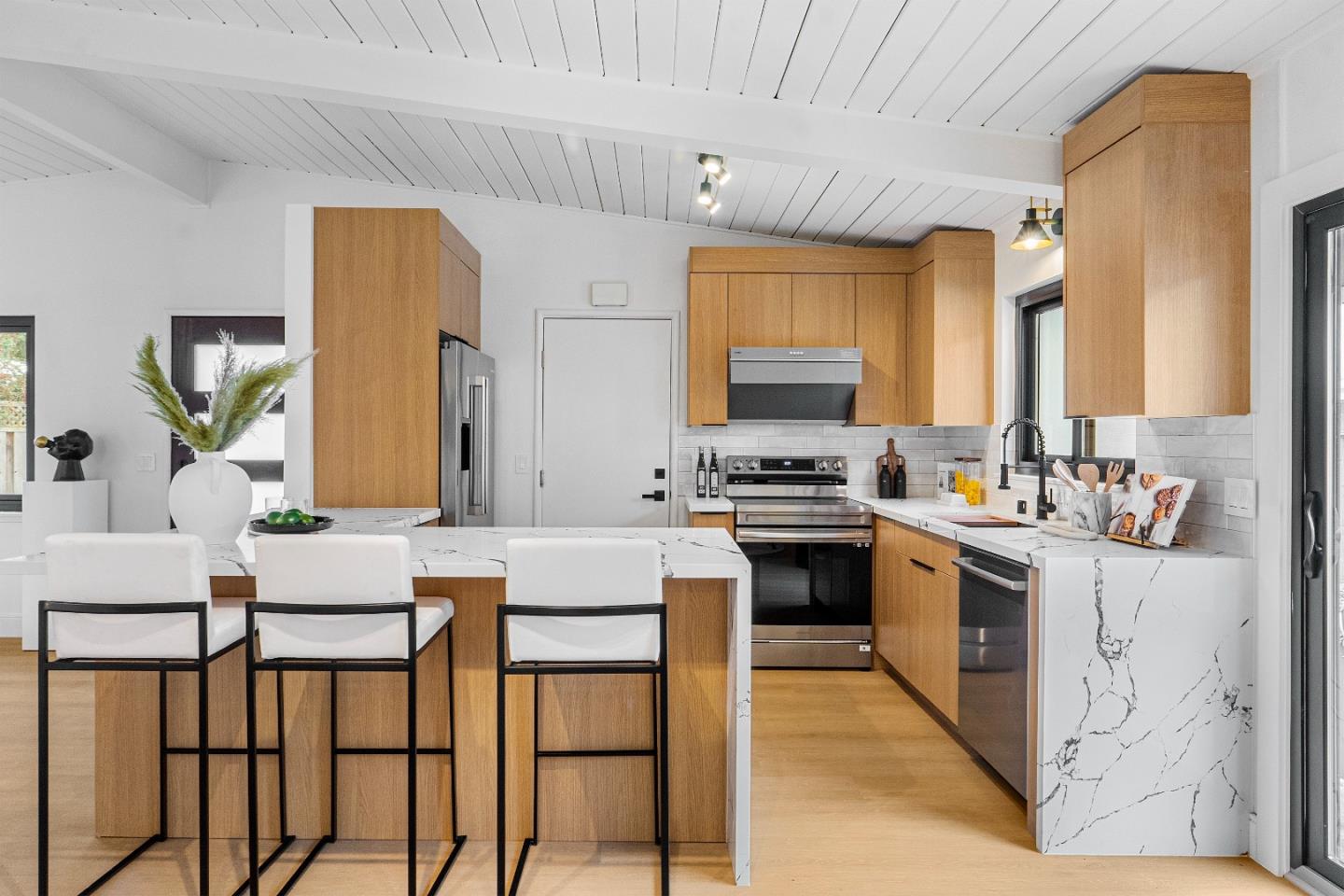 369 Ruth Avenue Mountain View, CA 94043 - Photo 8 of 33 a kitchen with a table chairs sink and cabinets