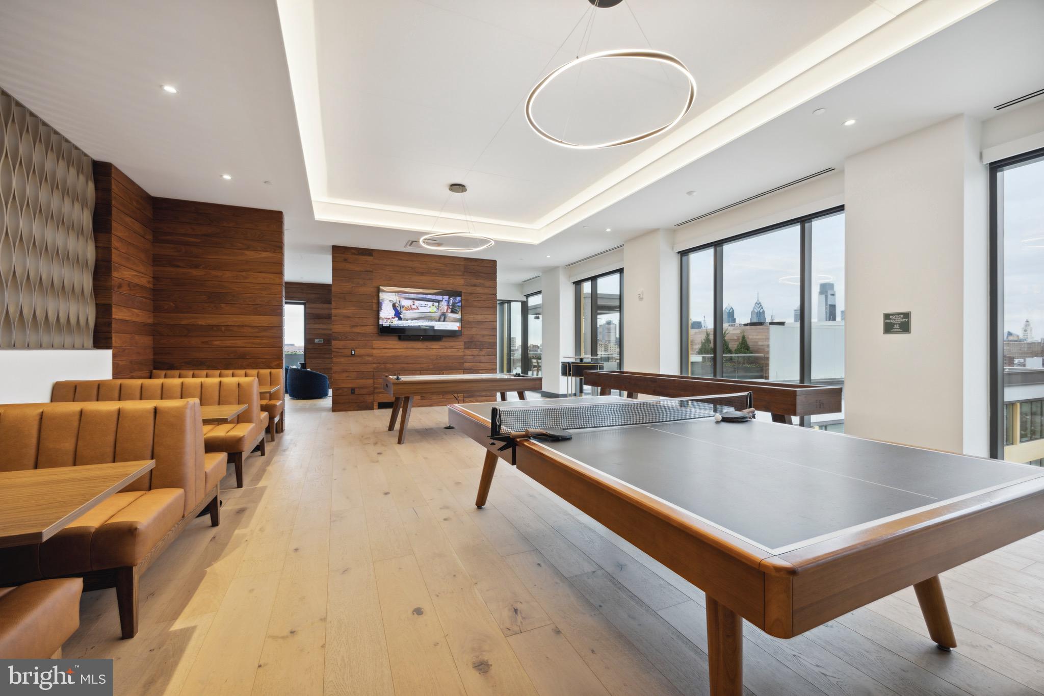 569 North 5th Street, Unit 723 Philadelphia, PA 19123 - Photo 41 of 49 a living room with furniture a large window and a potted plant