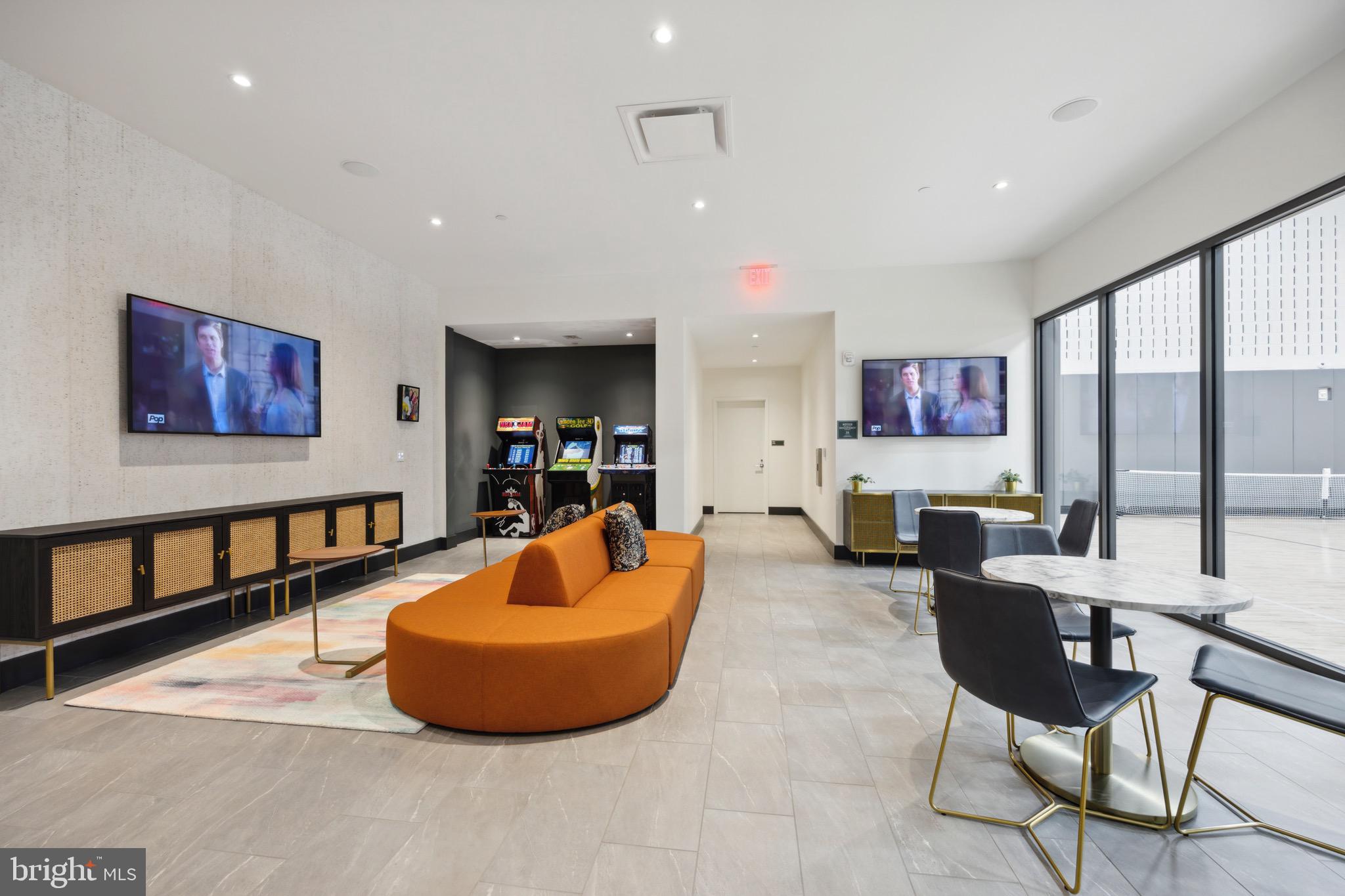 569 North 5th Street, Unit 723 Philadelphia, PA 19123 - Photo 48 of 49 a living room with furniture a flat screen tv and a large window