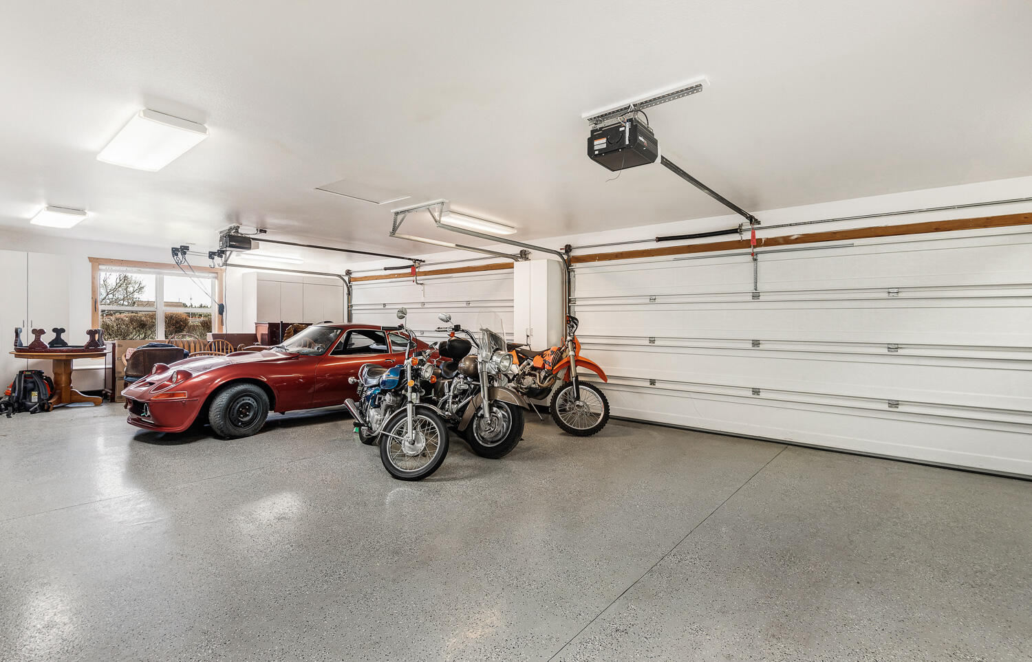 65260 Gerking Market Road Bend, OR 97703 - Photo 23 of 35 a view of a garage with parked cars