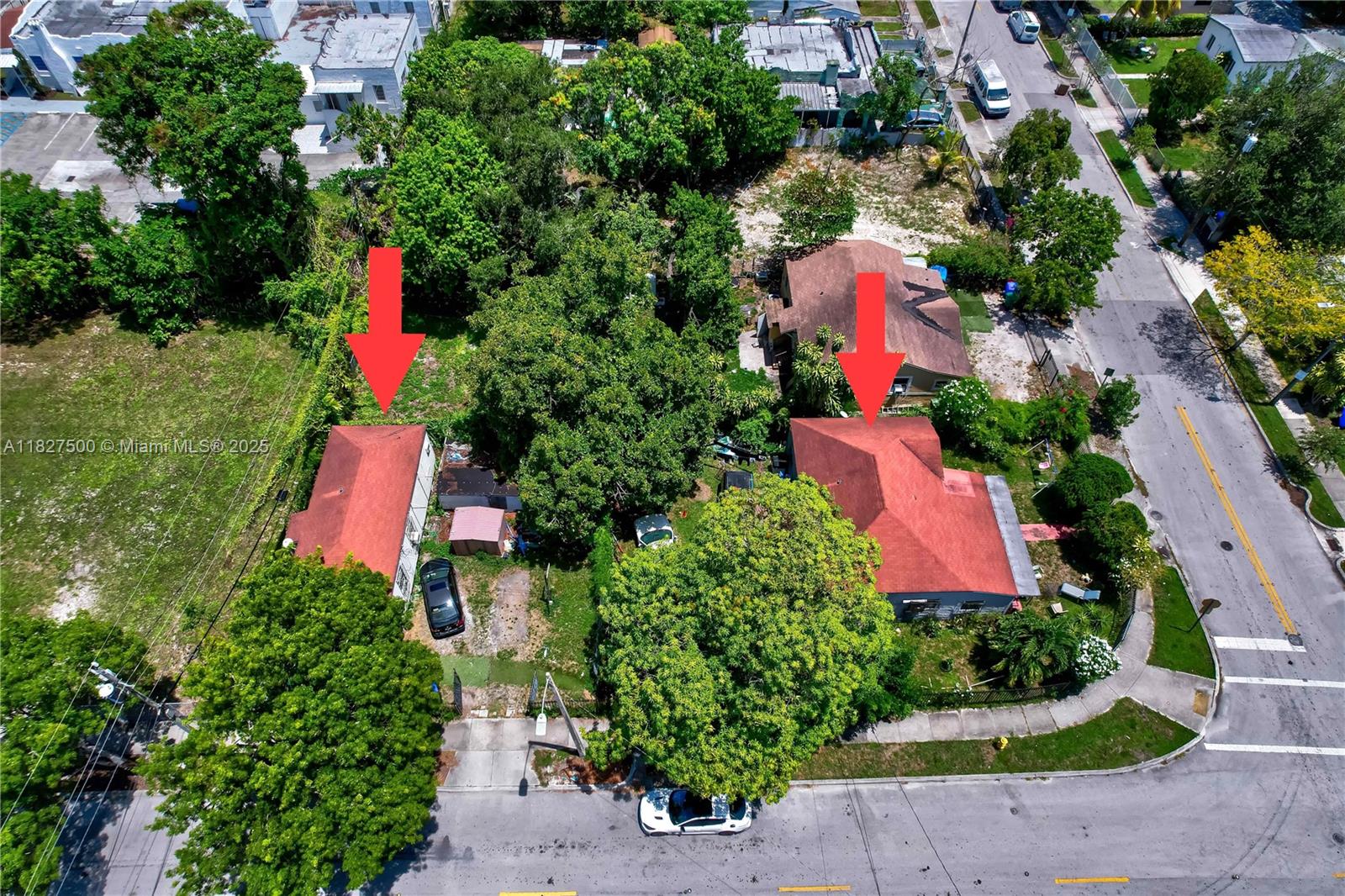 an aerial view of house with yard and outdoor seating