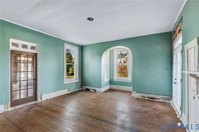 a view of a room with window wooden floor and windows