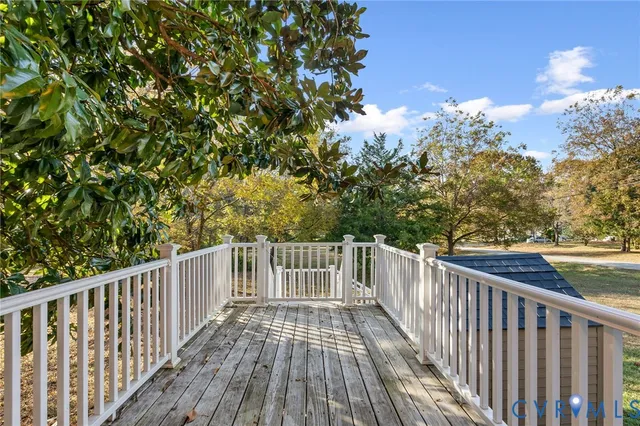a view of balcony with wooden floor