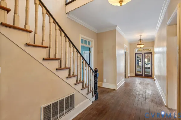 a view of an entryway with wooden floor