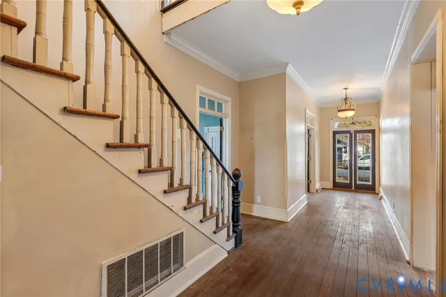 a view of an entryway with wooden floor