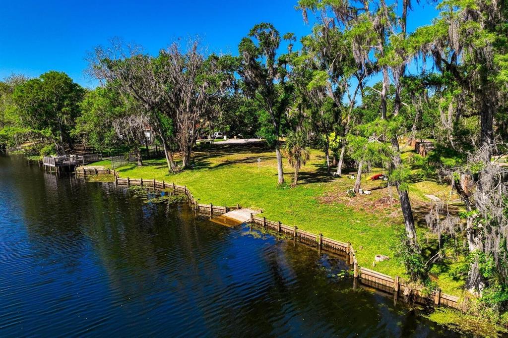 7810 Terrace Oaks Court Temple Terrace, FL 33617 - Photo 16 of 18 a view of a lake with houses