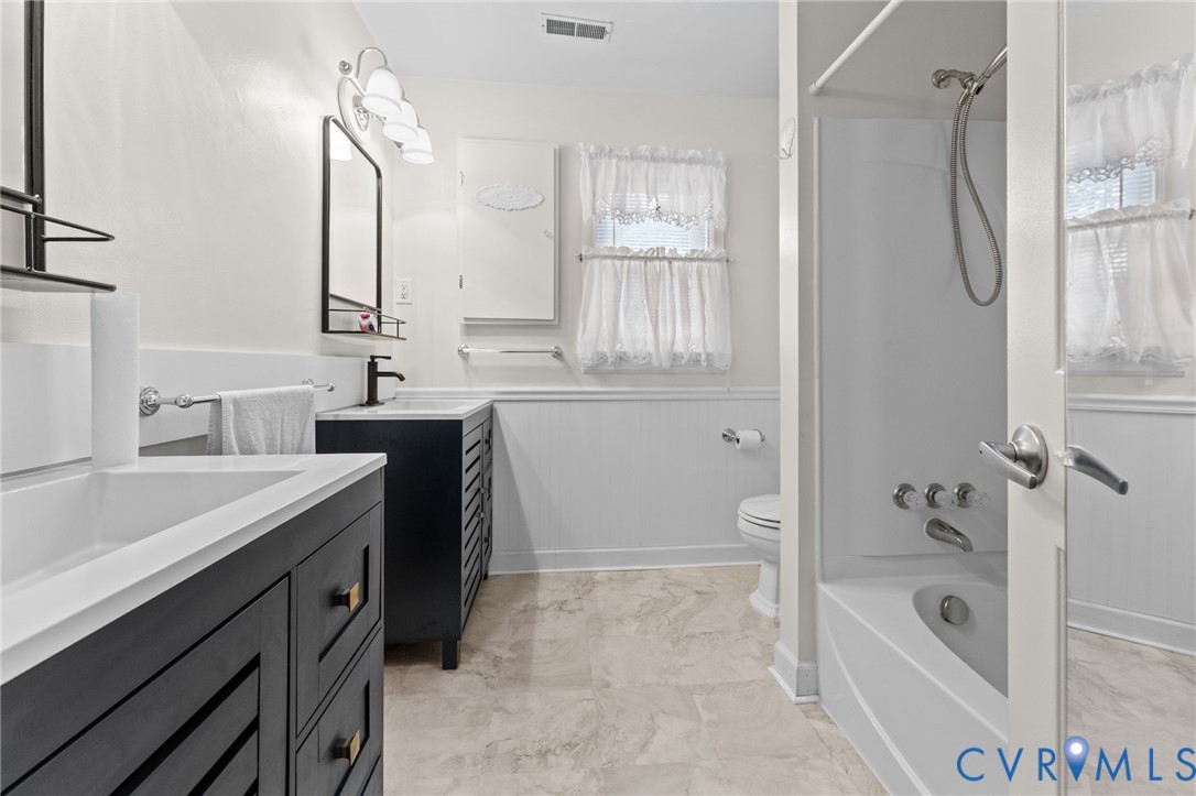 1760 Gloucester Road Gloucester Point, VA 23062 - Photo 37 of 47 Bathroom featuring two dark-toned vanities with in