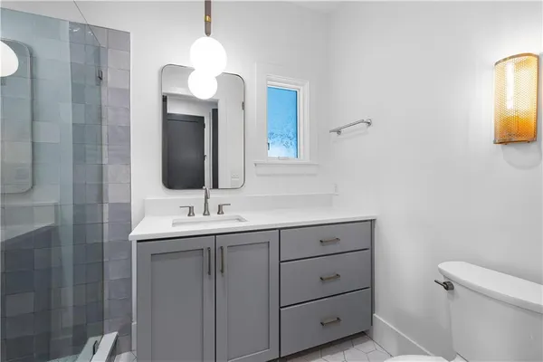 a car parked in front of a white building