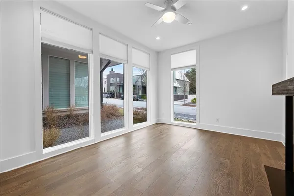 a kitchen with stainless steel appliances granite countertop a sink a refrigerator and a stove top oven